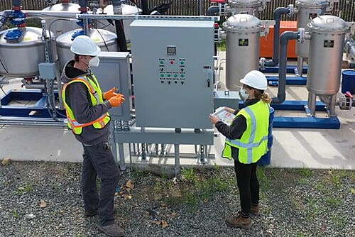 Consultants Doing Maintenance on Treatment System